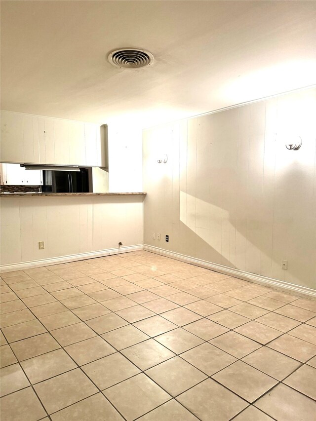 empty room with light tile patterned floors