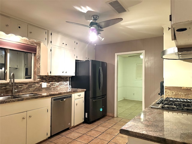 kitchen with decorative backsplash, stainless steel appliances, white cabinetry, and sink