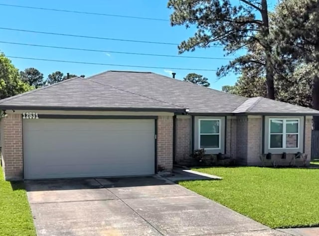 ranch-style home with a front yard and a garage