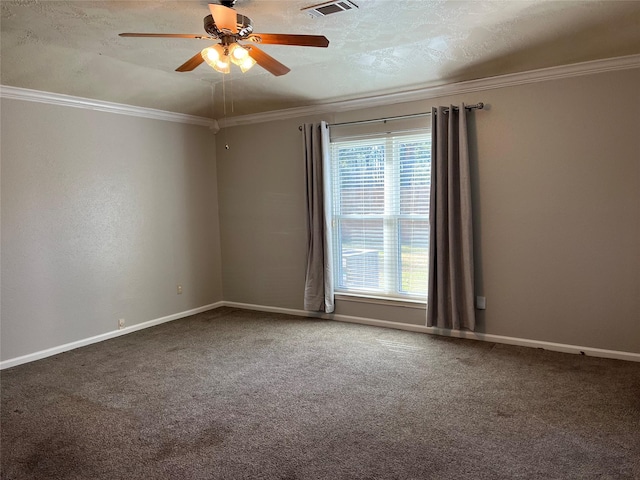 carpeted empty room featuring crown molding, plenty of natural light, and ceiling fan