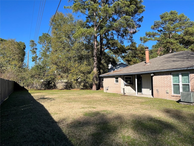 view of yard with central AC unit