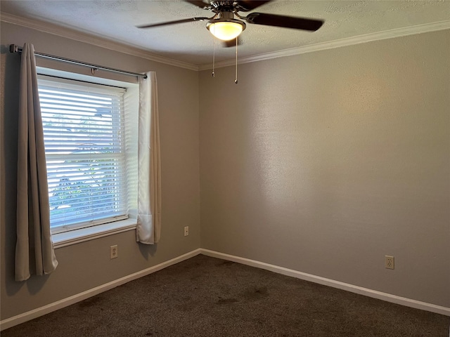 carpeted spare room featuring ceiling fan and crown molding