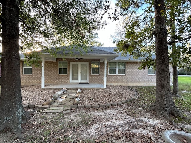 rear view of house with a patio and french doors