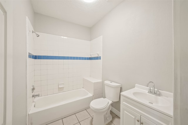 full bathroom featuring tile patterned floors, vanity, a textured ceiling, tiled shower / bath combo, and toilet