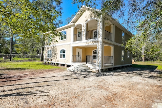 view of front of home with a balcony