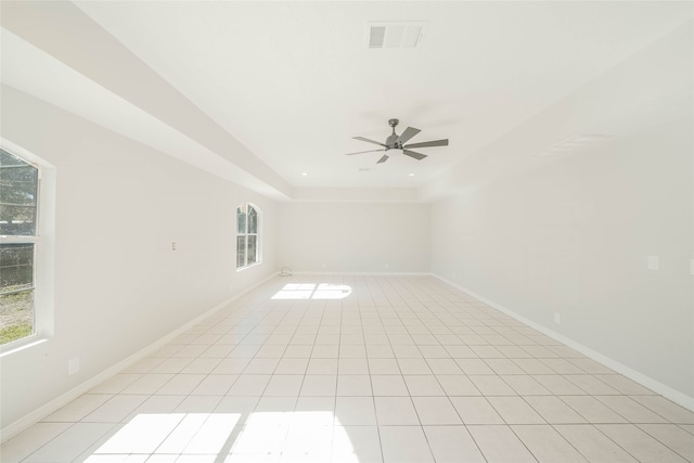 spare room featuring ceiling fan and light tile patterned floors