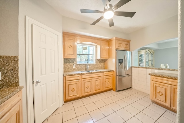 kitchen with ceiling fan, sink, light brown cabinets, stainless steel fridge with ice dispenser, and light tile patterned floors