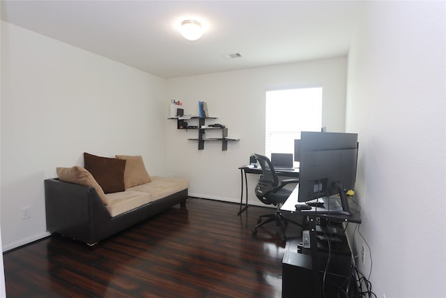 home office with dark hardwood / wood-style floors