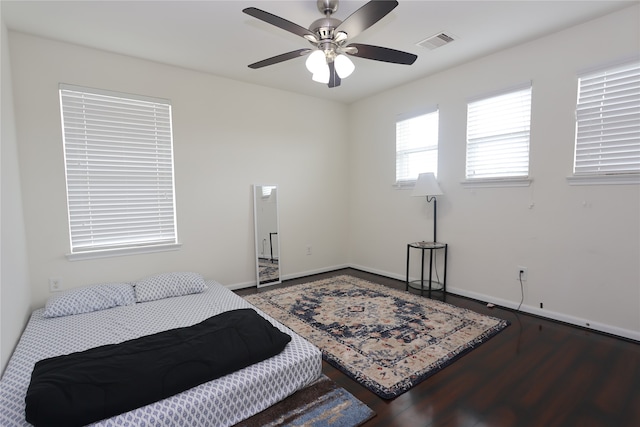 bedroom featuring ceiling fan and dark hardwood / wood-style floors