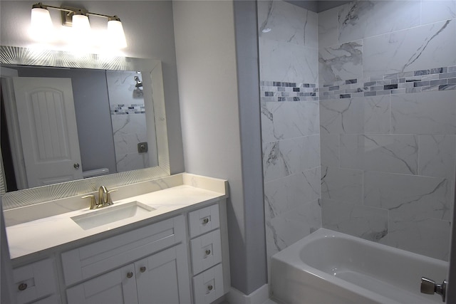 bathroom featuring vanity and tiled shower / bath combo