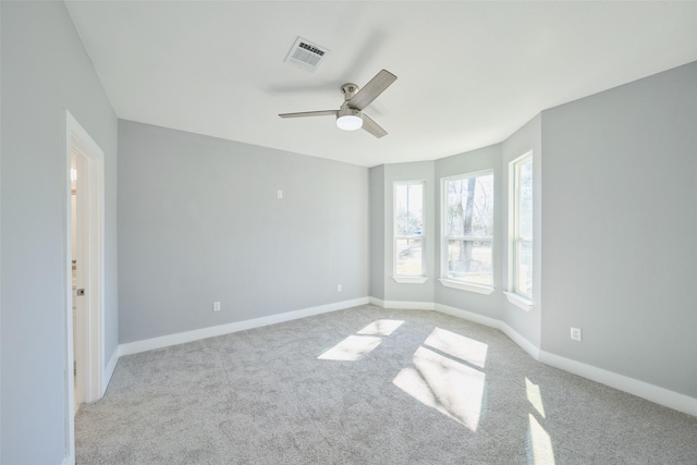 carpeted empty room with ceiling fan