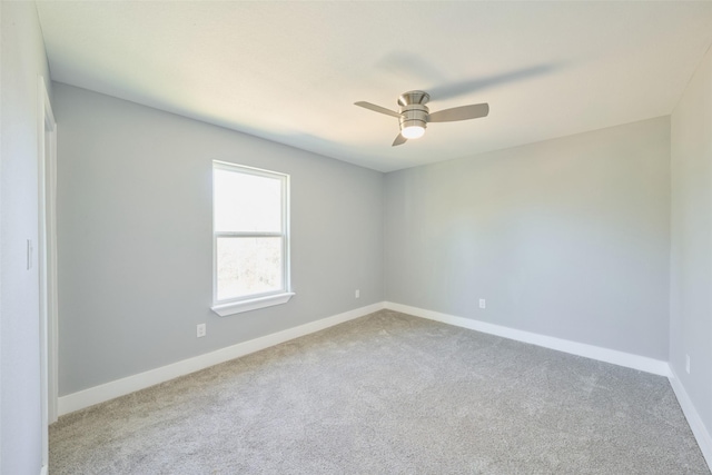 empty room with ceiling fan and carpet flooring