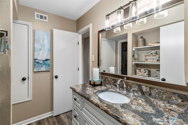 bathroom featuring vanity and wood-type flooring