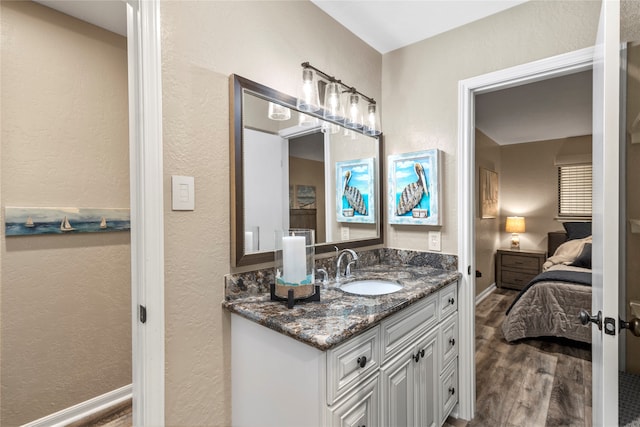 bathroom featuring wood-type flooring and vanity