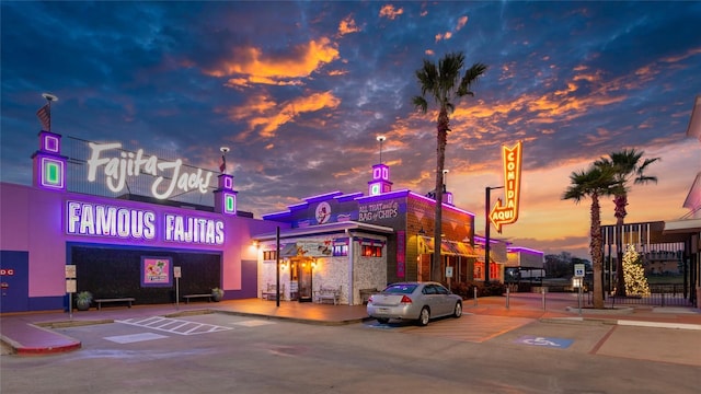 view of outdoor building at dusk