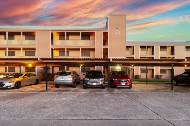 view of outdoor building at dusk