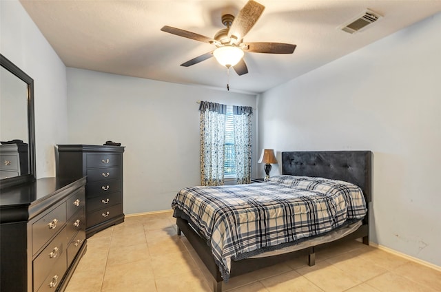 bedroom with ceiling fan and light tile patterned floors