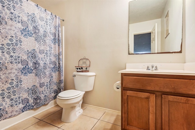 bathroom with a shower with curtain, tile patterned flooring, vanity, and toilet