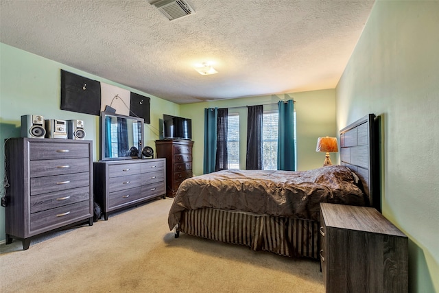 carpeted bedroom with a textured ceiling