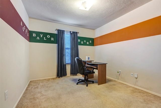 office featuring carpet and a textured ceiling