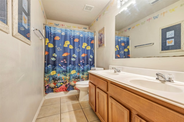 full bathroom featuring shower / bath combo with shower curtain, tile patterned flooring, vanity, and toilet