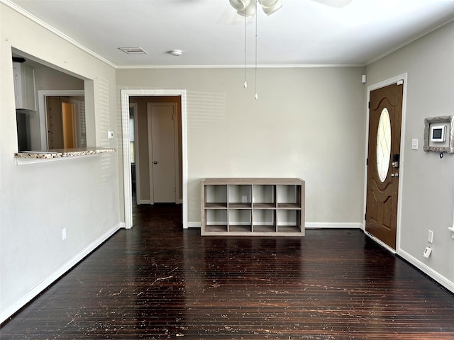 foyer entrance featuring ceiling fan, dark hardwood / wood-style flooring, and ornamental molding