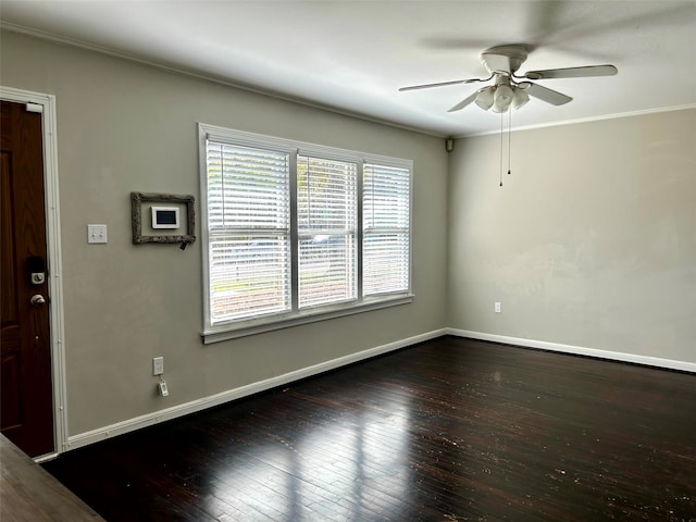 unfurnished room with ceiling fan, dark hardwood / wood-style flooring, and crown molding