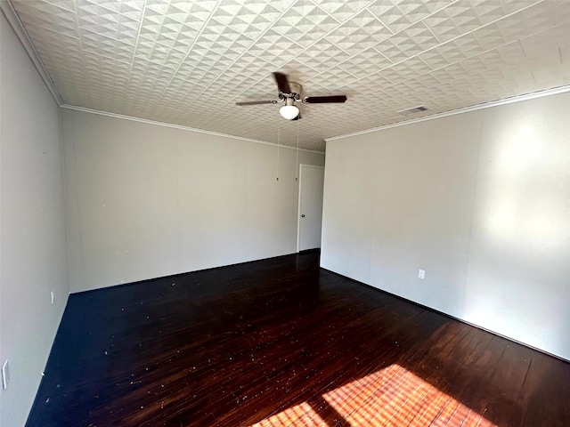 empty room with crown molding, ceiling fan, and dark wood-type flooring