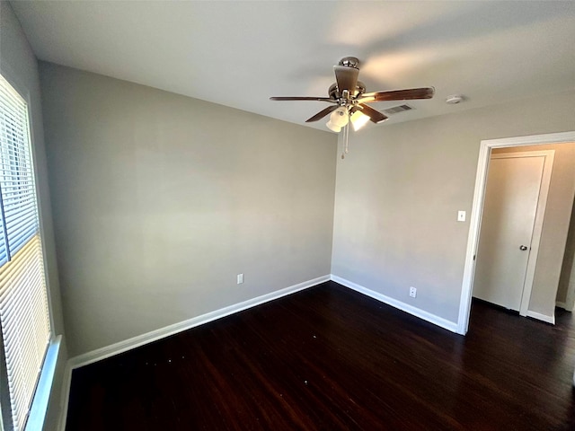 empty room featuring dark hardwood / wood-style flooring