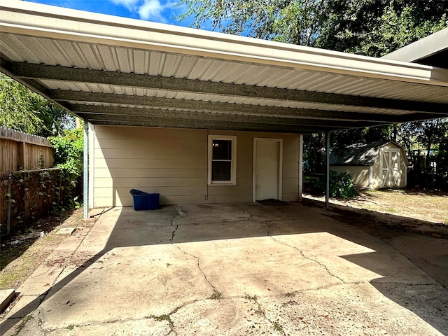 view of patio with a carport and a shed