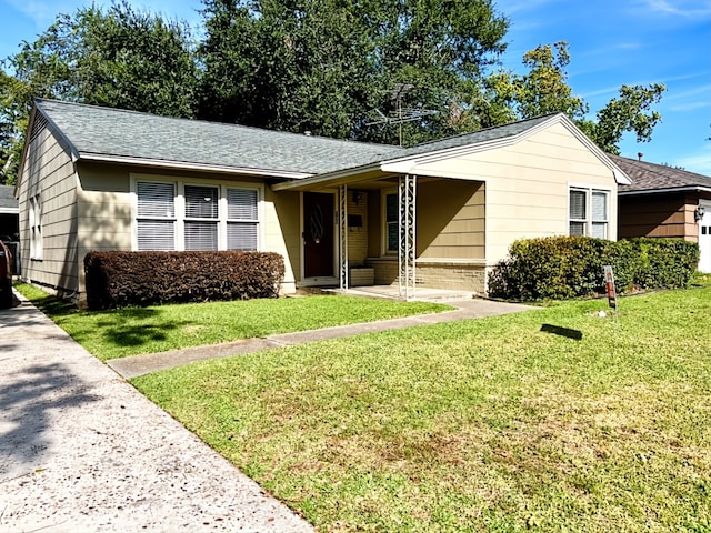 view of front of home with a front lawn