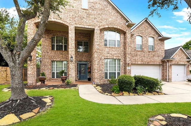 view of front facade featuring a garage and a front lawn