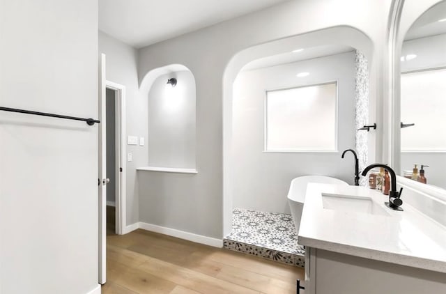 bathroom featuring hardwood / wood-style floors and vanity