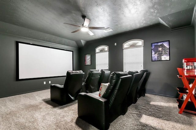 home theater room with carpet, a textured ceiling, ceiling fan, and lofted ceiling