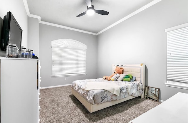 bedroom with ceiling fan, crown molding, and light carpet