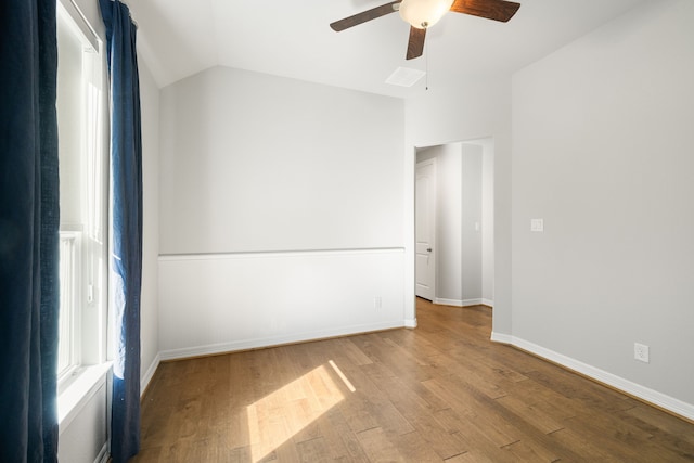 empty room featuring light hardwood / wood-style floors, ceiling fan, and lofted ceiling