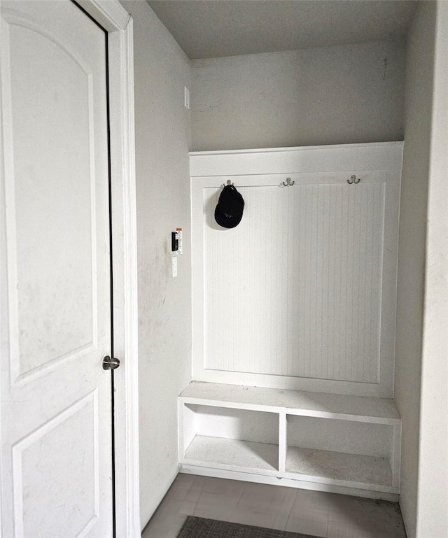 mudroom with light tile patterned floors