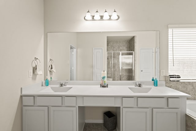 bathroom with separate shower and tub and vanity