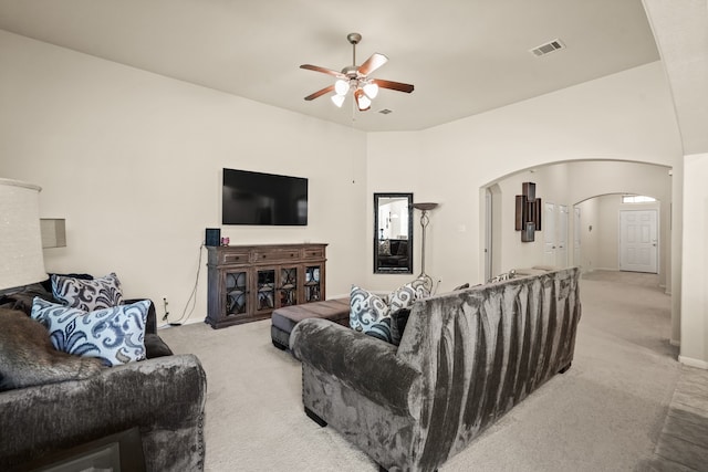 carpeted living room featuring ceiling fan