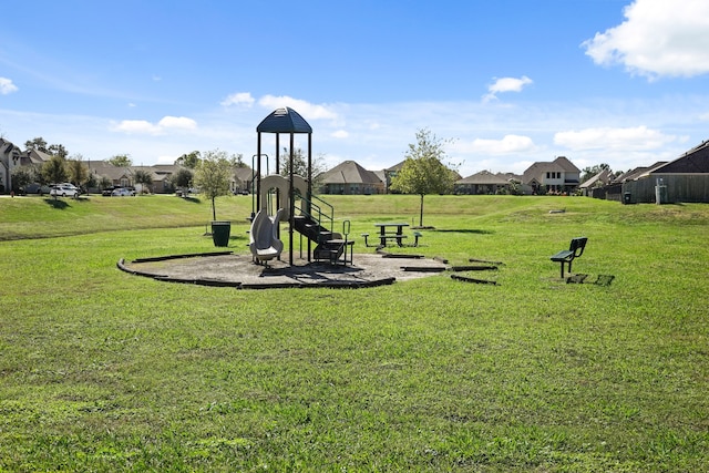 view of property's community with a yard