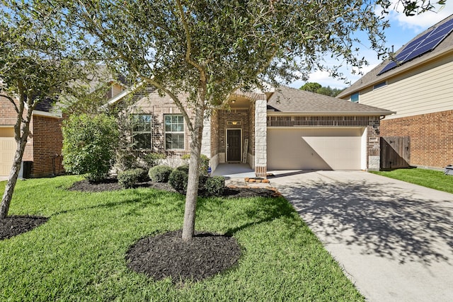 view of front of house with a front yard and a garage