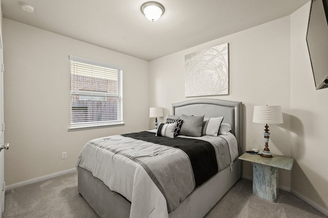 bedroom with light colored carpet