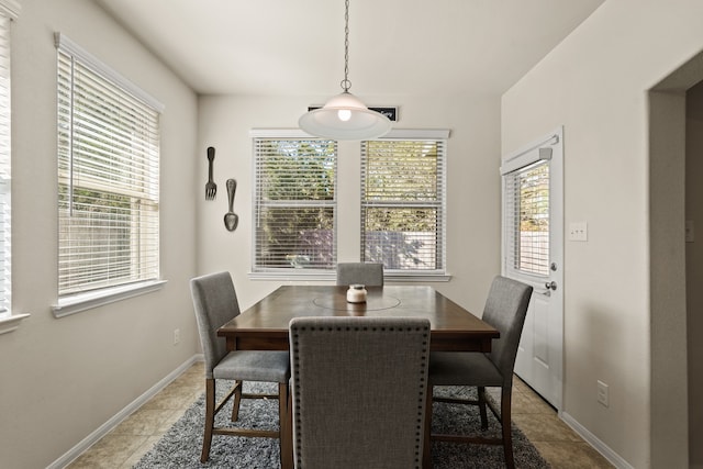 dining area with tile patterned flooring