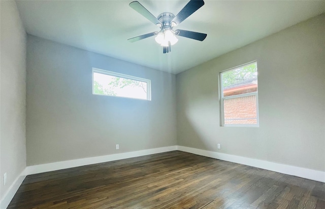 2222 Peppermill Rd, Houston, TX 77080 - empty room with healthy amount of natural light, baseboards, and dark wood-style floors