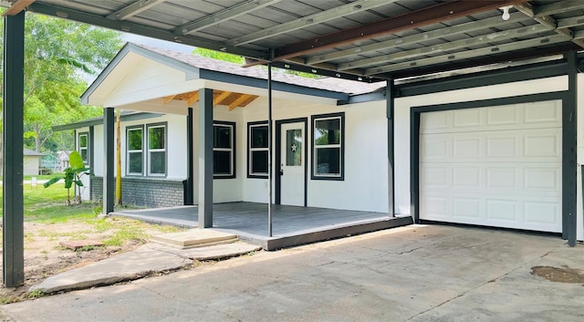 2222 Peppermill Rd, Houston, TX 77080 - doorway to property featuring covered porch and a garage