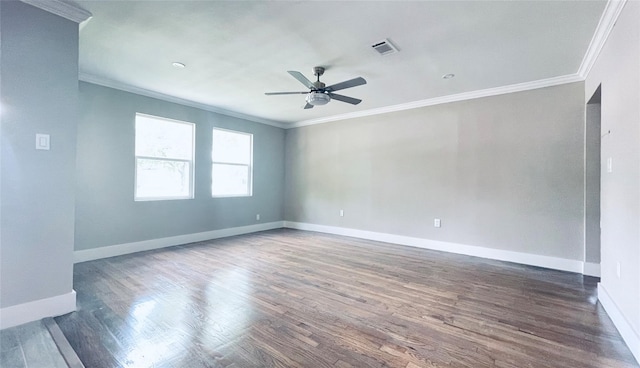 spare room with crown molding, ceiling fan, and dark hardwood / wood-style floors