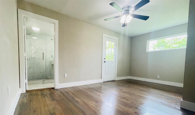 spare room with ceiling fan and hardwood / wood-style flooring