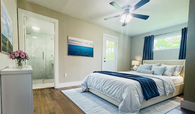 bedroom featuring ceiling fan, dark hardwood / wood-style flooring, and multiple windows