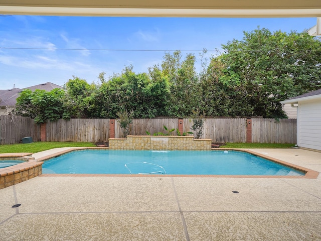 view of swimming pool with an in ground hot tub and a patio