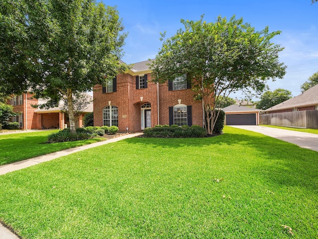 view of front of home featuring a garage and a front yard